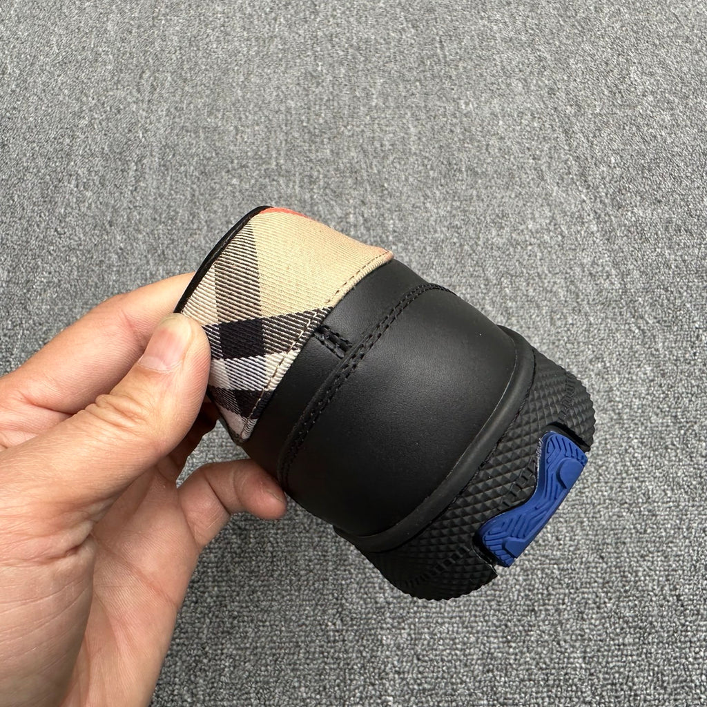 Black sneaker heel with beige check panel and rubber tread sole