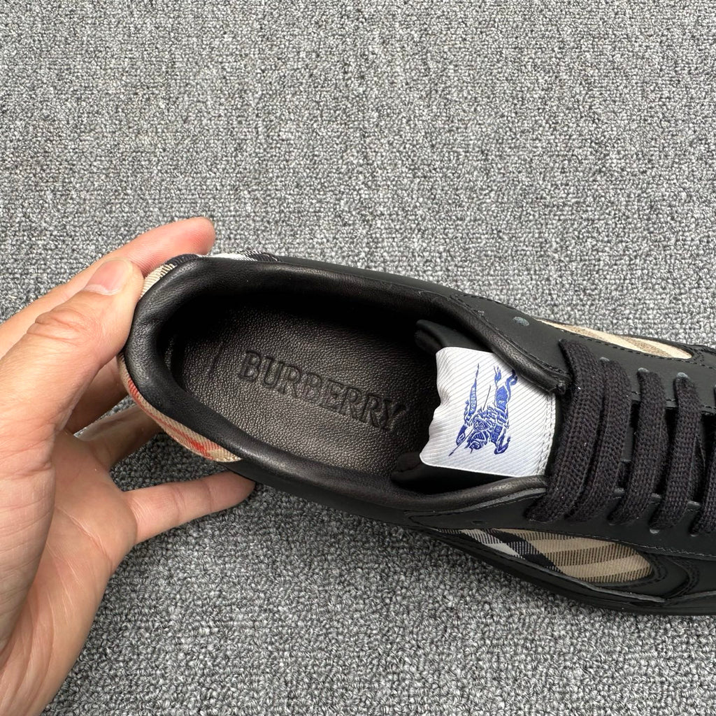 Black sneaker interior with Burberry logo on insole and lace-up opening