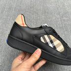 Black low-top sneaker with beige check overlay and lace-up vamp