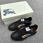 Black low-top sneakers with lace-up front and beige check side panel