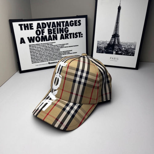 Burberry baseball cap in beige and black plaid with red lines and bold #9 graphic detail