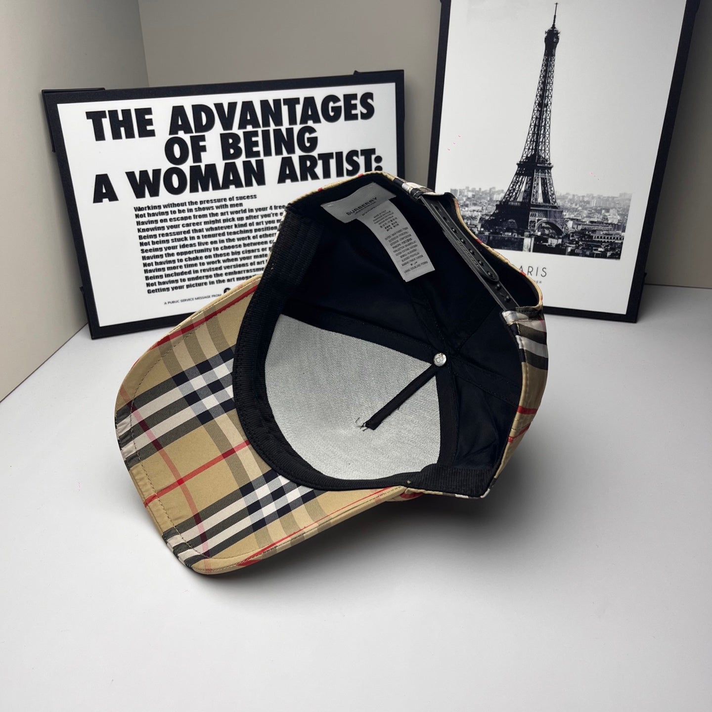Burberry baseball cap with beige, navy and red plaid top and dark underside brim