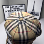 Burberry plaid baseball cap with gathered top and round fabric button in beige and navy