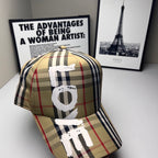Burberry baseball cap in beige and navy plaid with red accents and oversized white #9 graphic