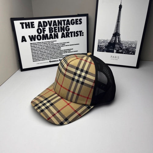 Burberry cap with beige, navy and red plaid crown and brim, black mesh side panels