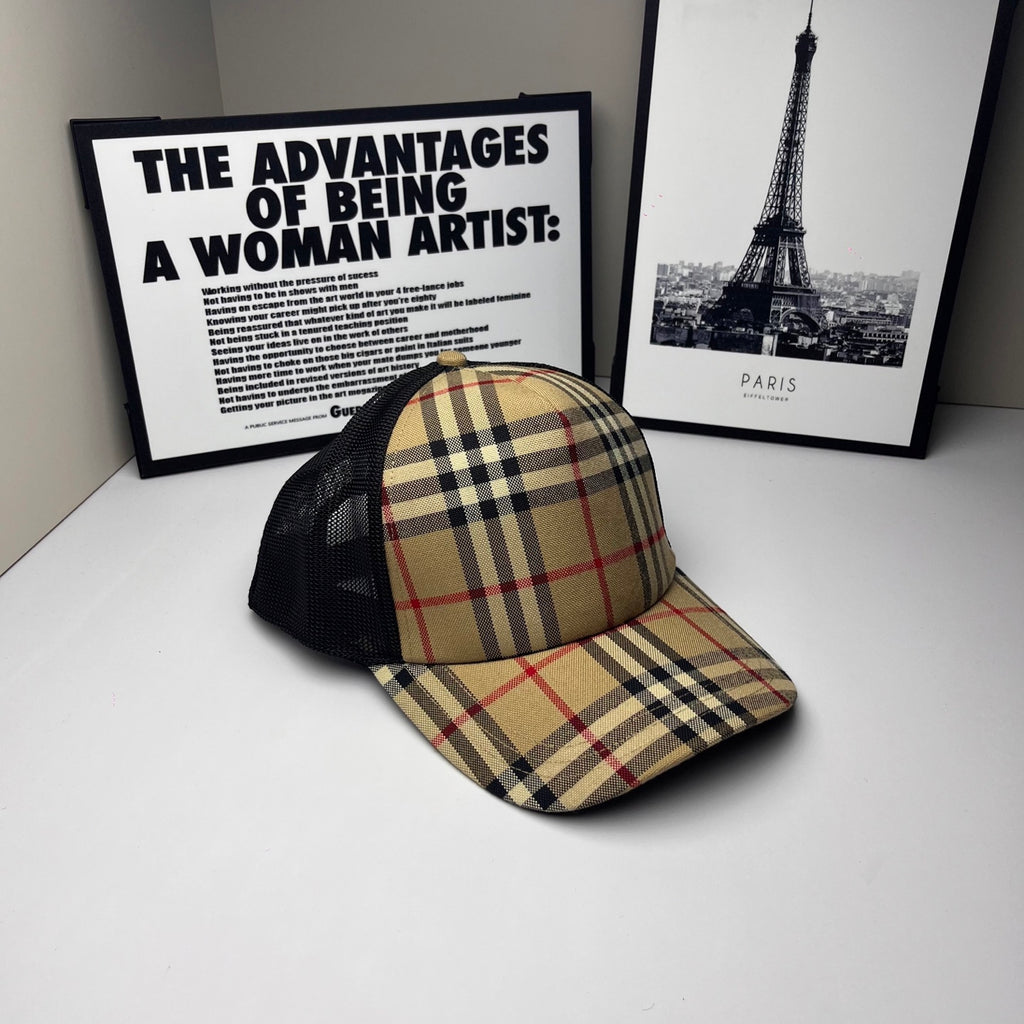 Burberry cap in beige, navy and red plaid with black mesh sides and curved brim