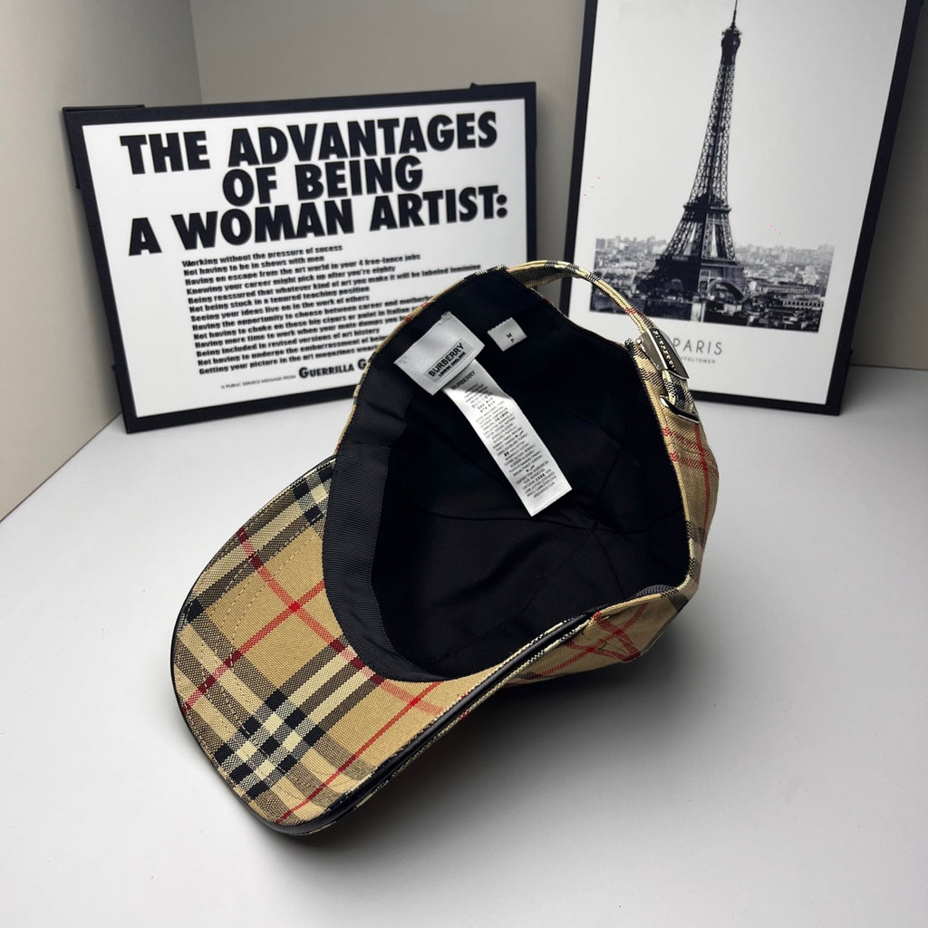 Plaid baseball cap with black interior lining and hanging label