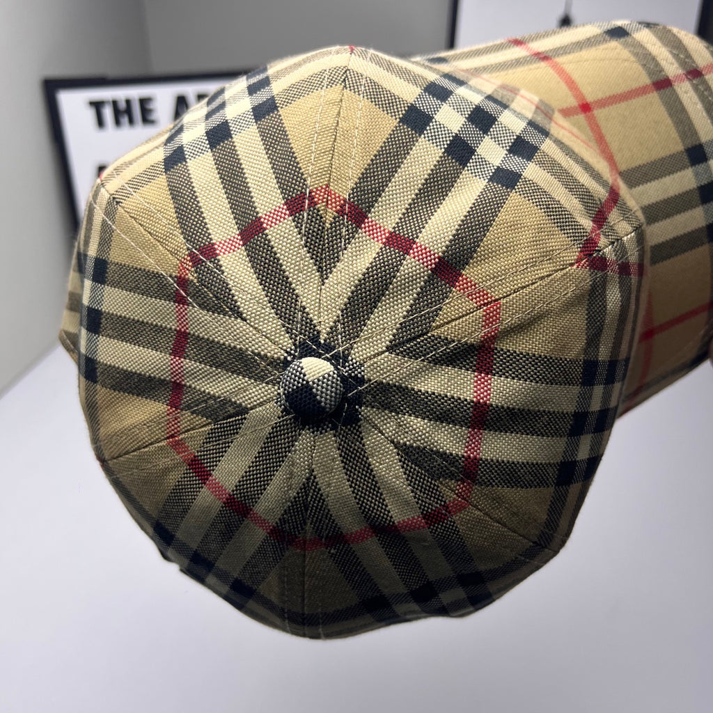 Plaid baseball cap in beige, navy, and red, top view with decorative stitching