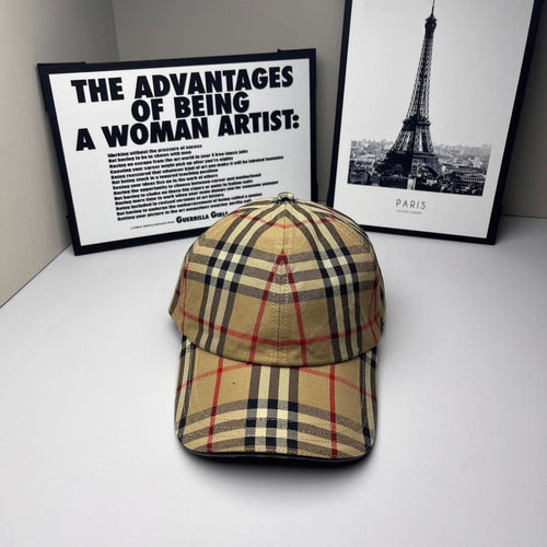 Plaid baseball cap in beige, navy, and red with metal eyelet on top