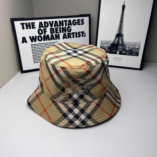 Burberry bucket cap in beige, navy, and red plaid with embroidered crest front