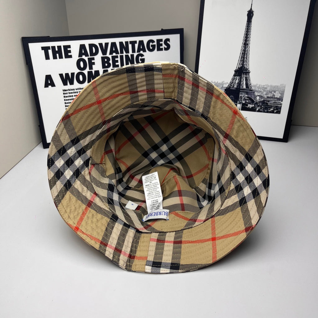 Plaid bucket cap interior view with stitched brim, beige, navy, and red check lining
