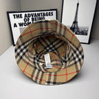 Plaid bucket cap interior view with stitched brim, beige, navy, and red check lining