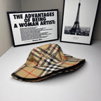 Plaid bucket cap laid flat, beige with navy and red check pattern