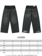 Front view of two-tone denim jeans with relaxed straight legs; size chart shown below.