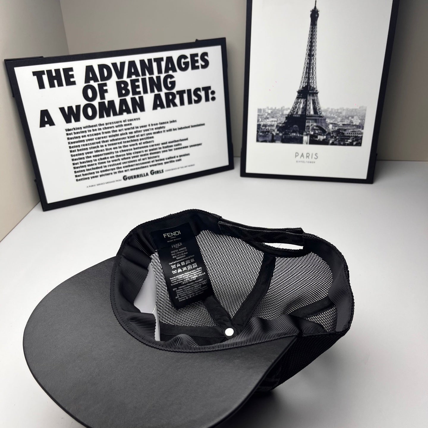 Fendi cap interior view with size/brand label, dark mesh crown and curved brim.