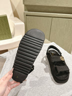 Black Gucci sandals outsole view with ribbed rubber tread