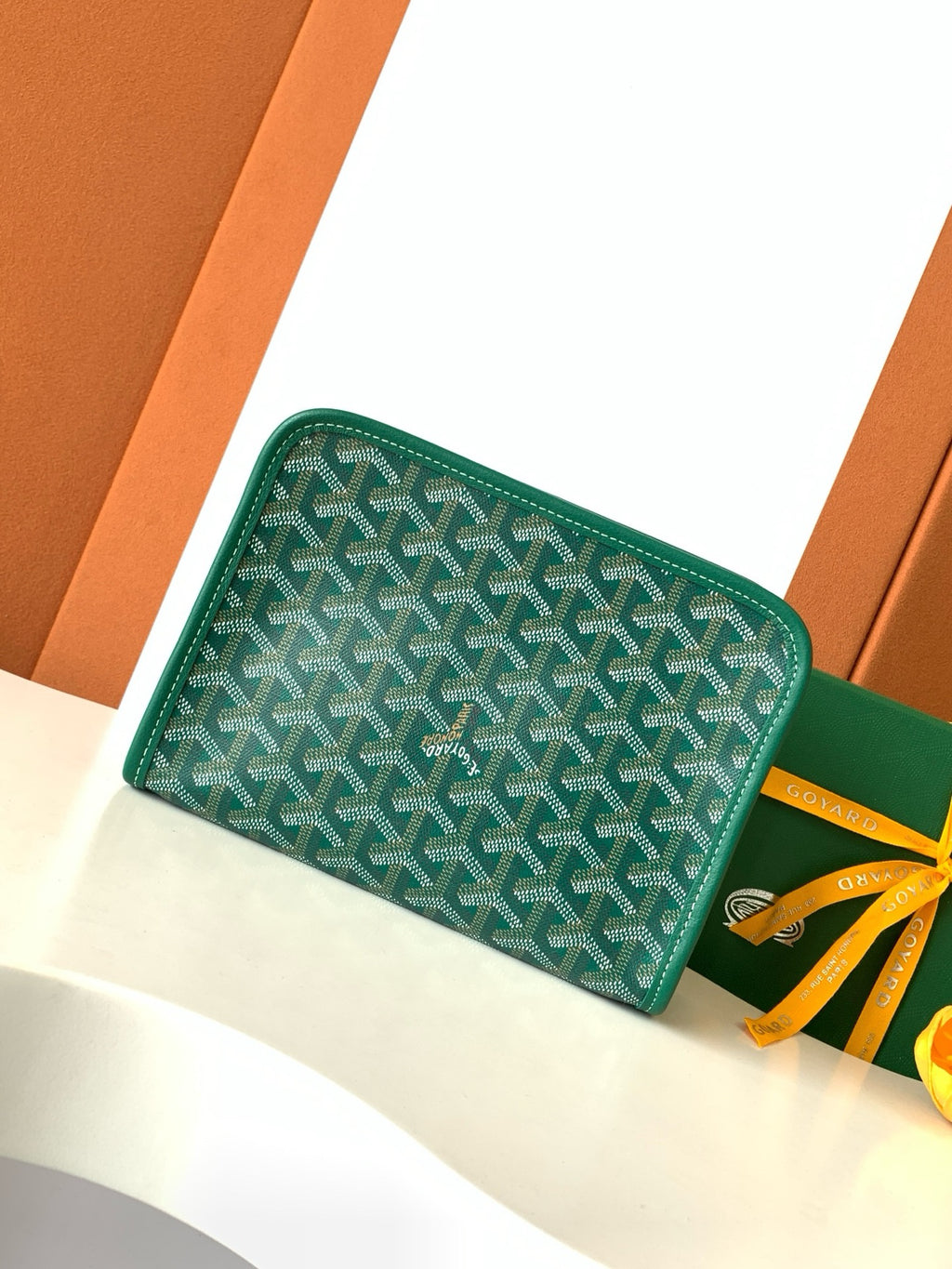 Goyard green patterned zip wallet with yellow ribbon tie