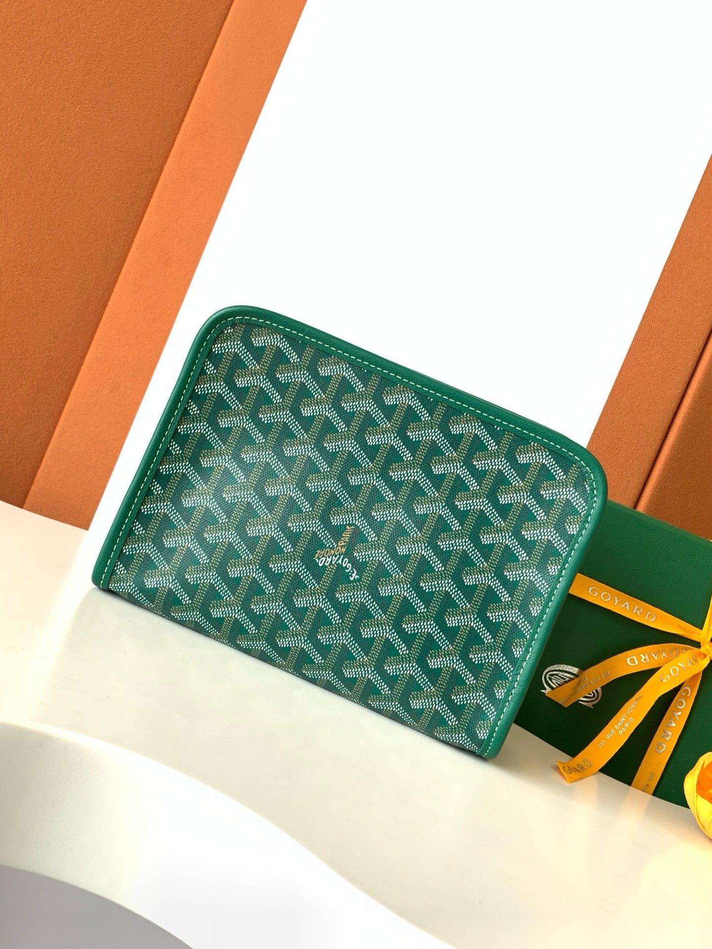 Goyard green patterned zip wallet with yellow ribbon tie