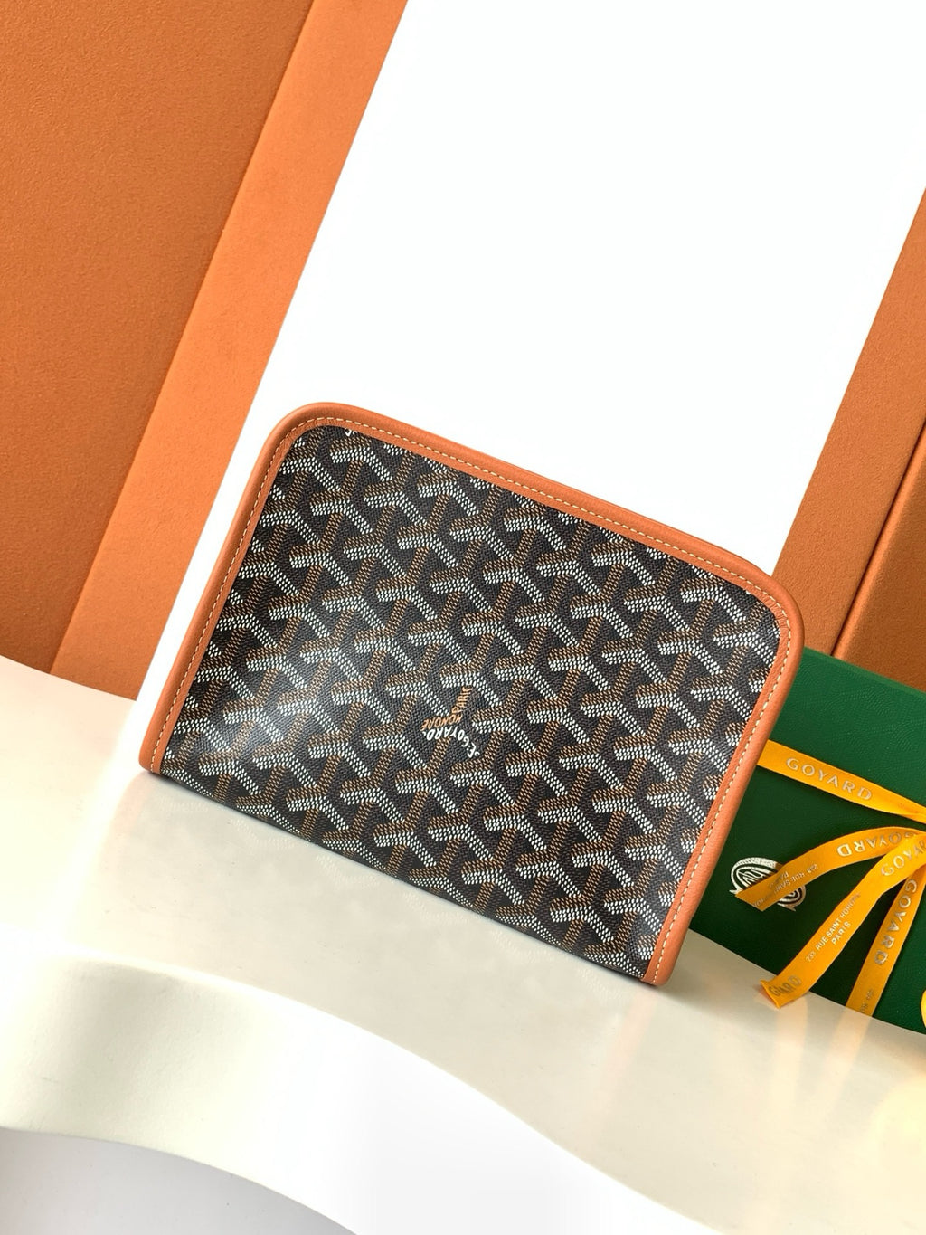 Goyard patterned zip pouch with brown edge piping, dark monogram fabric and zipper