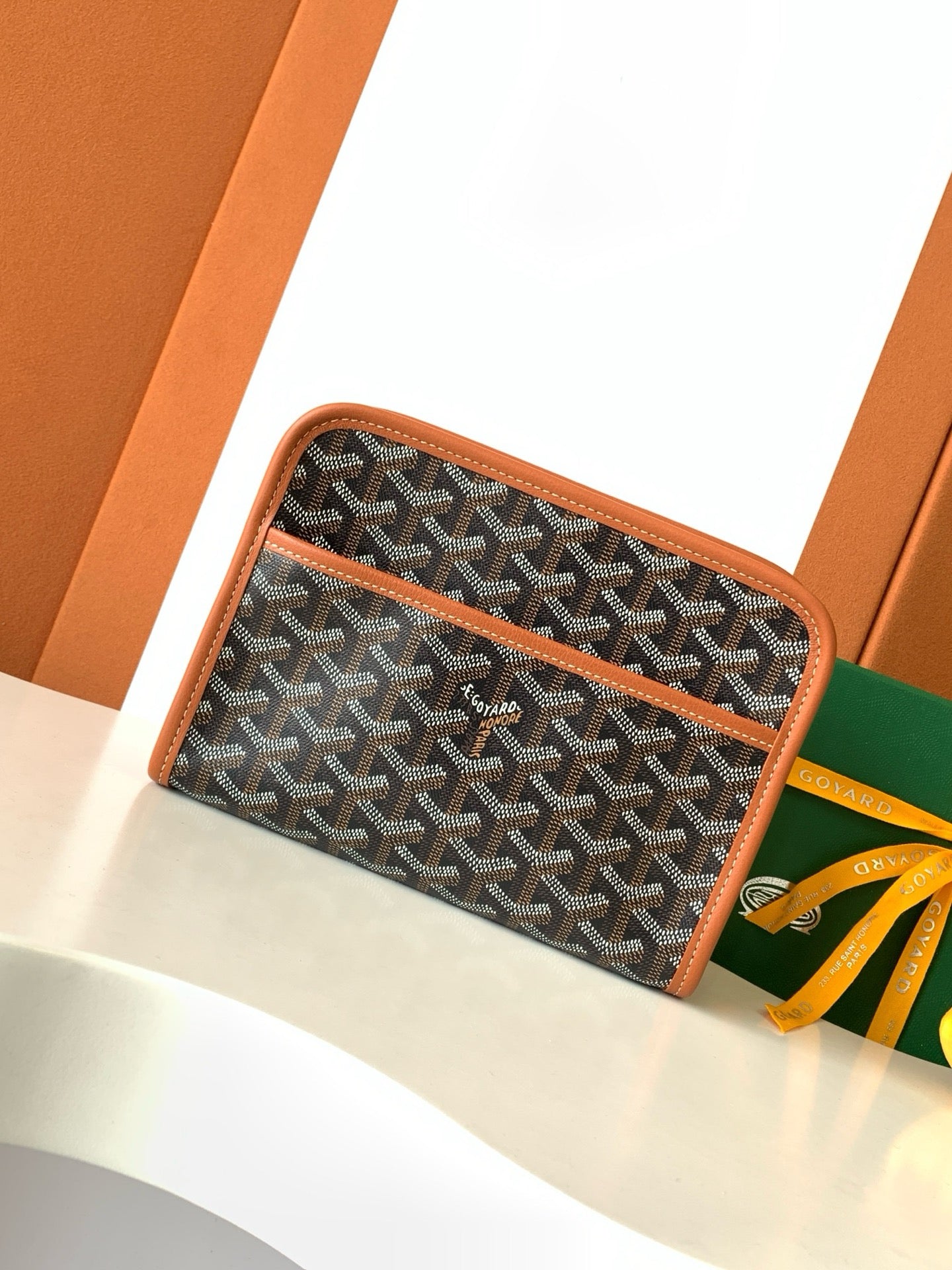 Goyard patterned zip pouch with brown trim, dark monogram fabric front