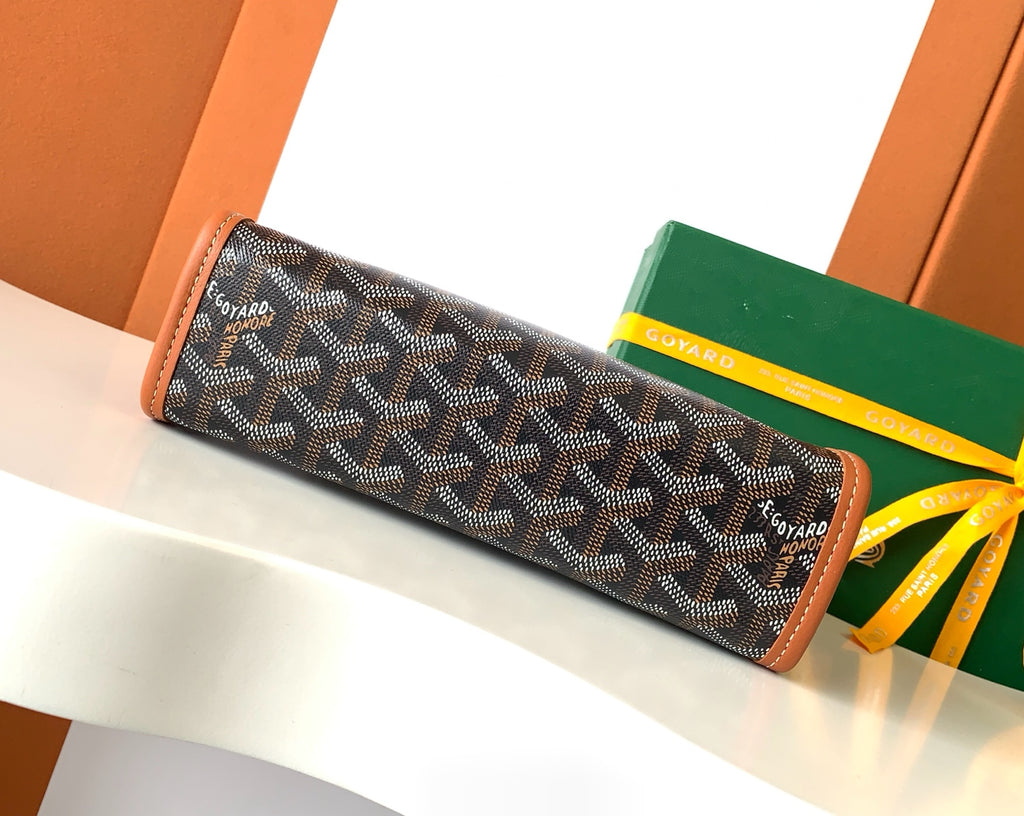 Goyard long zip pouch with dark monogram pattern and brown leather borders