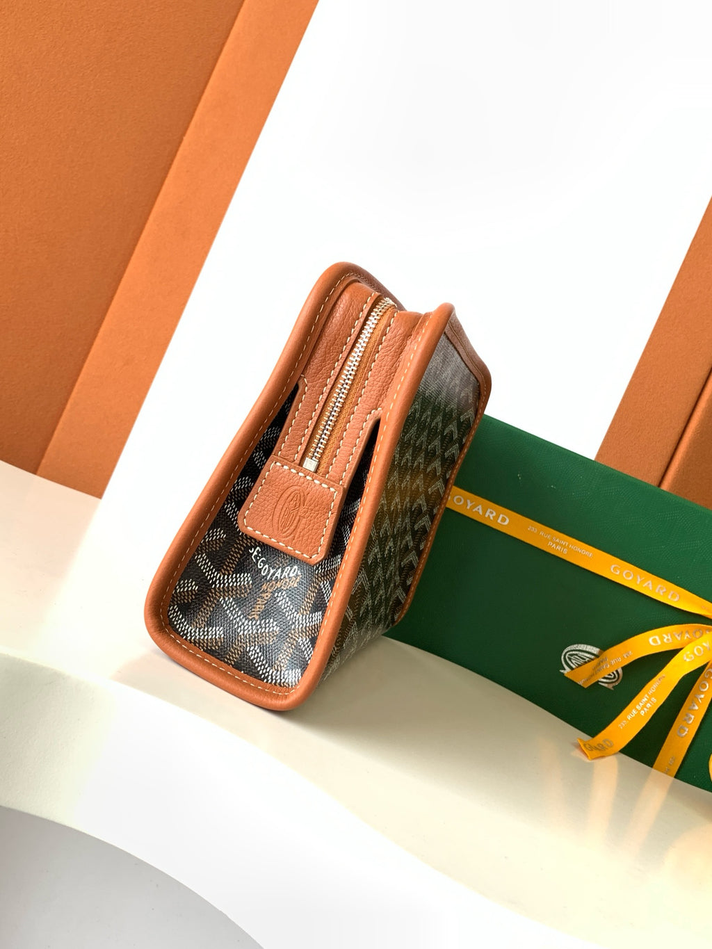 Goyard patterned zip pouch with front leather tab and brown edge trim
