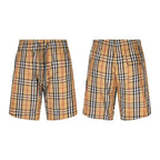 Burberry plaid shorts, drawstring and side pocket design shown from two angles