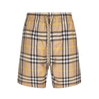 Plaid drawstring shorts with elastic waistband, beige and black checks with yellow lines