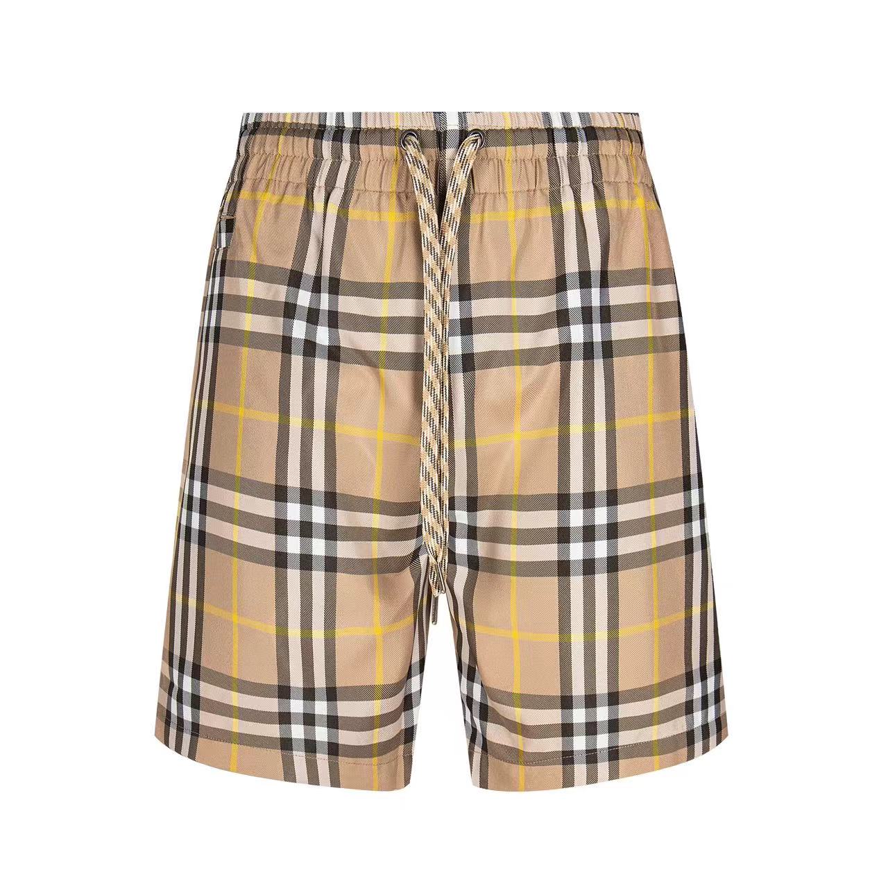Plaid drawstring shorts with elastic waistband, beige and black checks with yellow lines