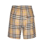 Plaid shorts with elastic waistband, drawstring, and side patch pocket detail