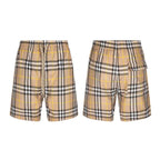 Plaid shorts with drawstring waist and side patch pockets, beige and black check pattern