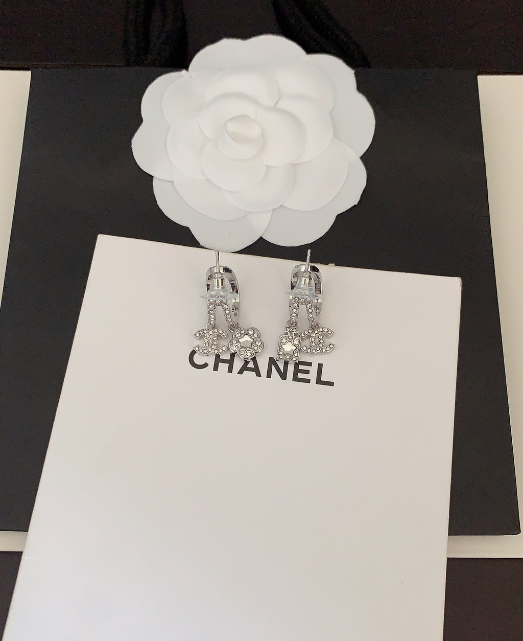 Silver-tone rhinestone Chanel drop earrings with CC charms