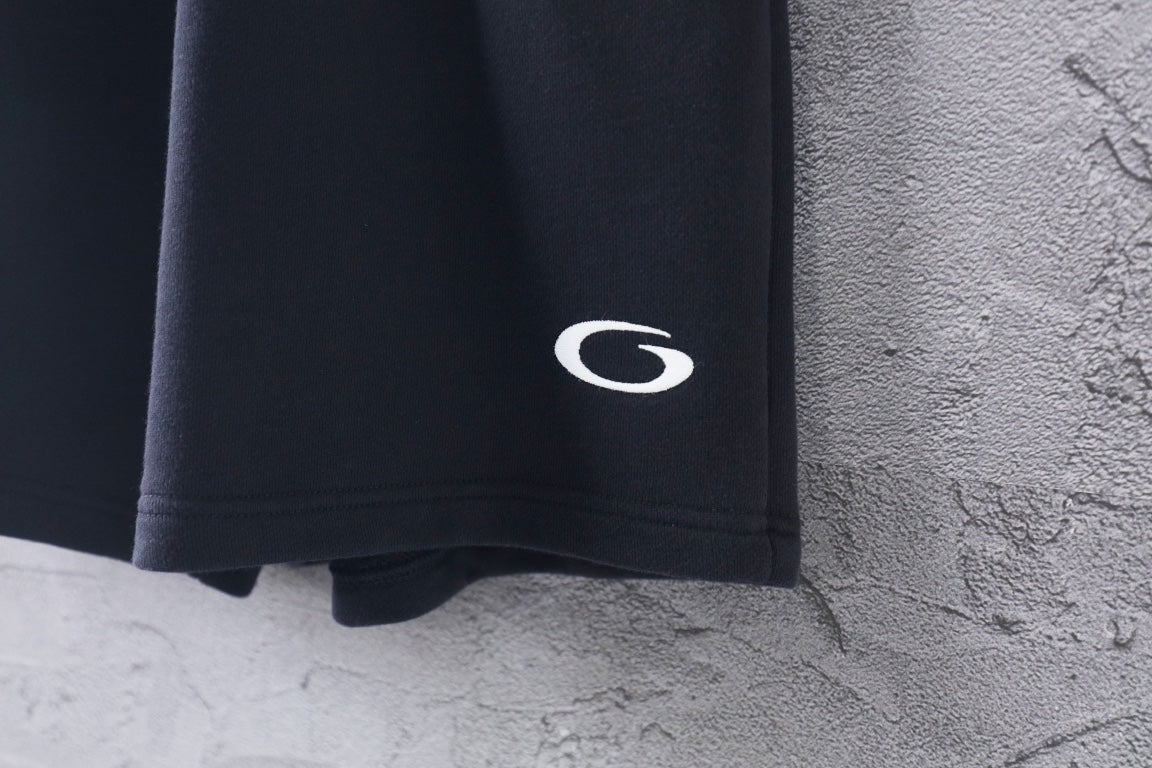 Dark short-length Balenciaga pants with C logo on side hem