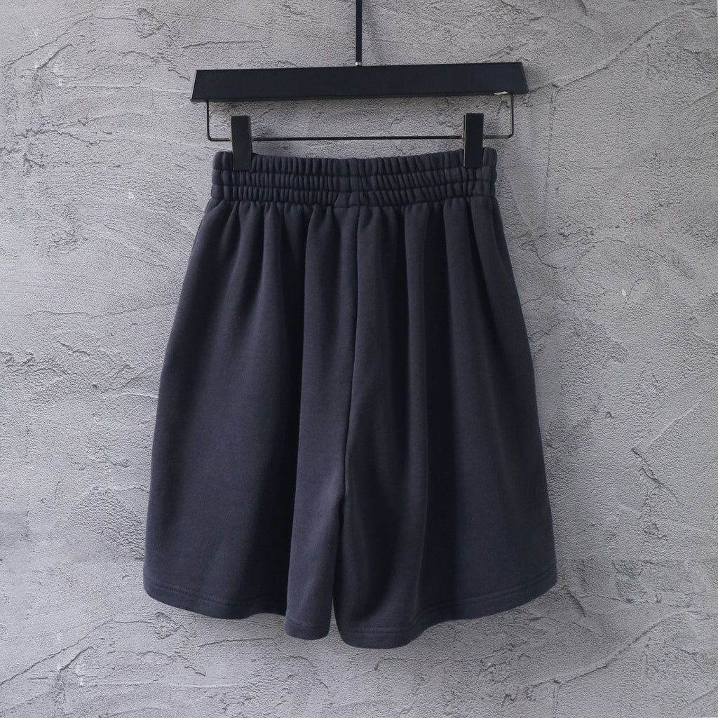 Dark short-length Balenciaga pants with elastic waistband and gathered front