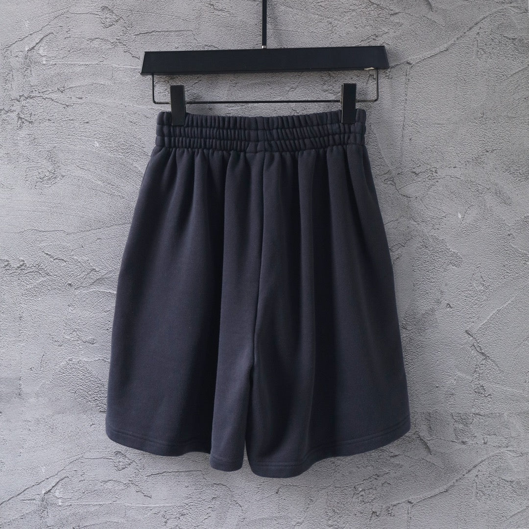 Dark short-length Balenciaga pants with elastic waistband and gathered front