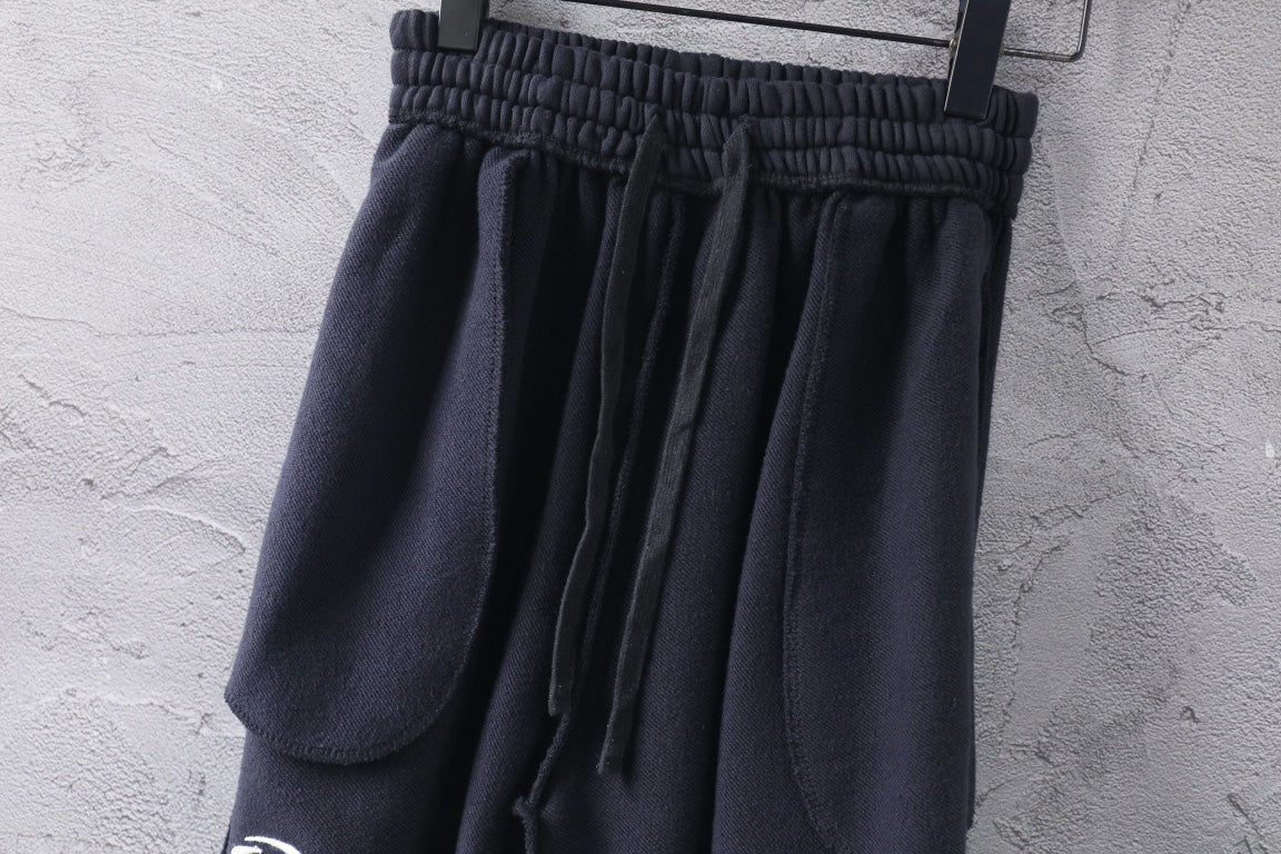 Dark Balenciaga pants with elastic waistband and draped pleats