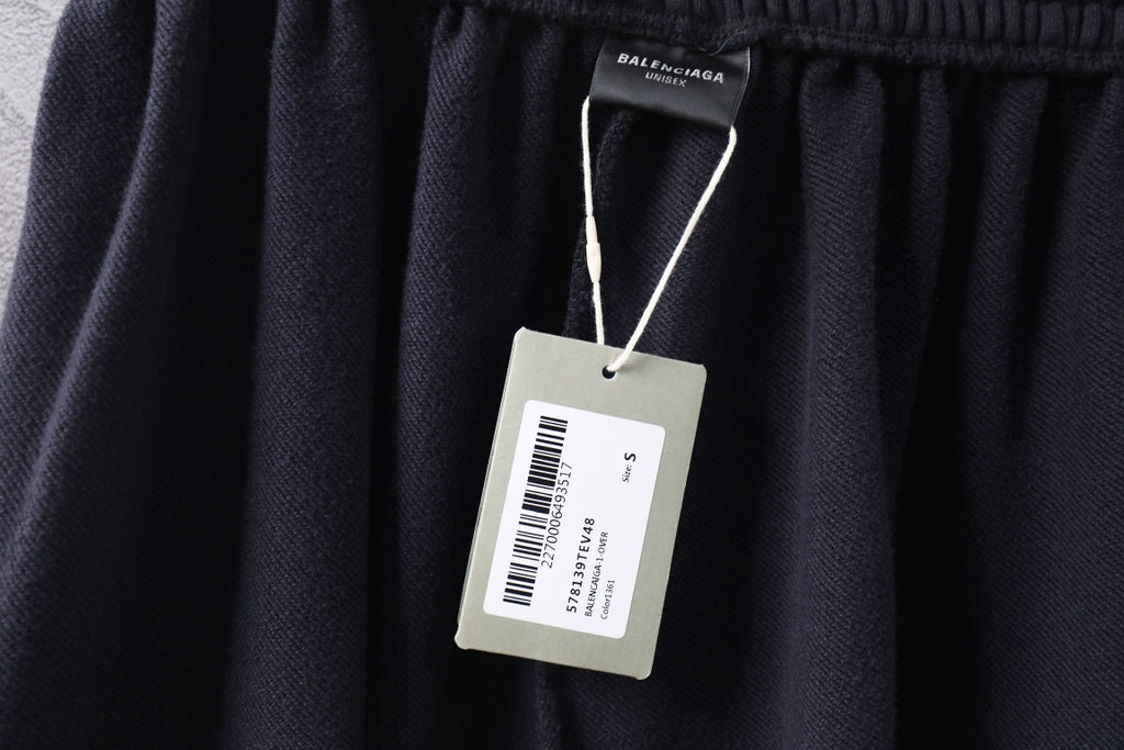 Dark Balenciaga pants with fabric waistband and hanging size label