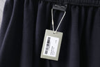 Dark Balenciaga pants with fabric waistband and hanging size label