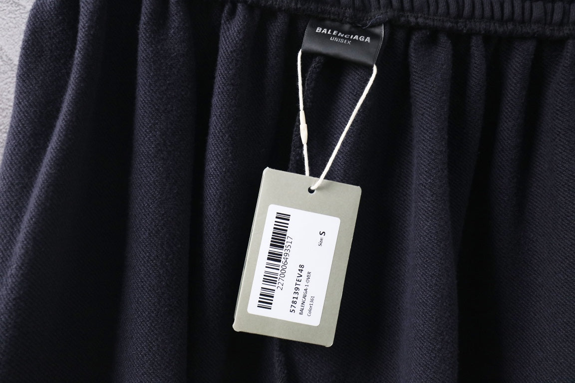 Dark Balenciaga pants with fabric waistband and hanging size label