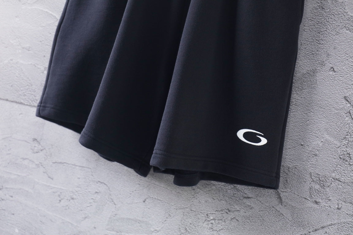 Dark short-length Balenciaga pants with side hem logo detail