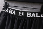 Black waistband with bold Balenciaga branding and Under Armour logo