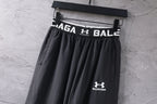 Black wide-leg pants with elastic waist and Under Armour Balenciaga logo