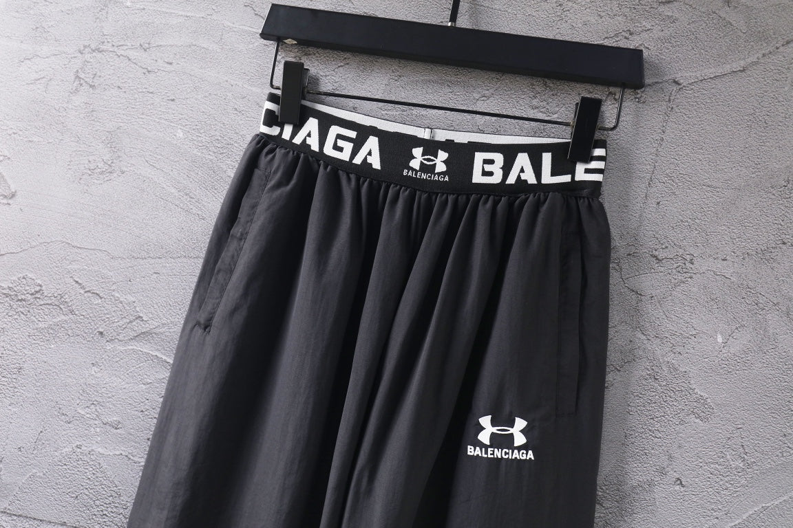 Black wide-leg pants with elastic waist and Under Armour Balenciaga logo