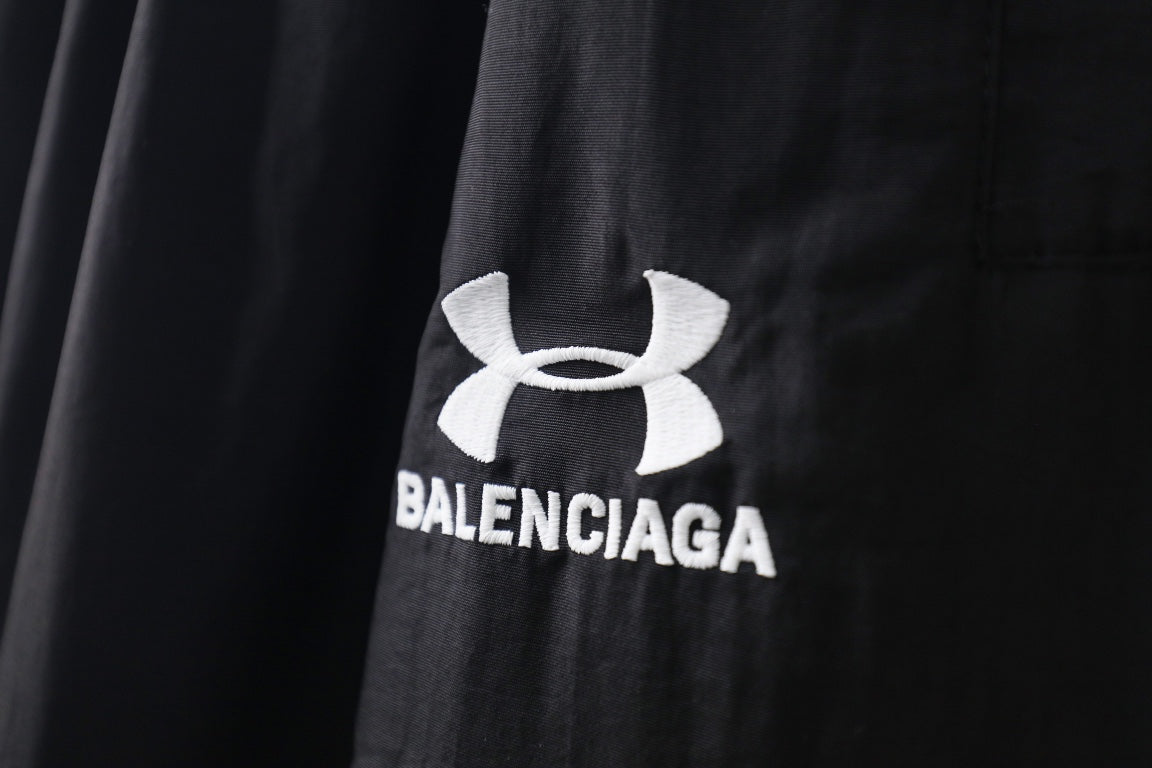 Black pants with white Under Armour and Balenciaga logo patch print