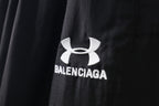 Black pants with Under Armour emblem and Balenciaga logo print