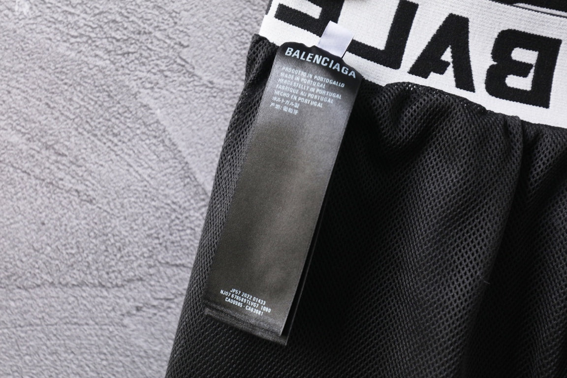Black pants with inner care label and mesh-lined waistband area