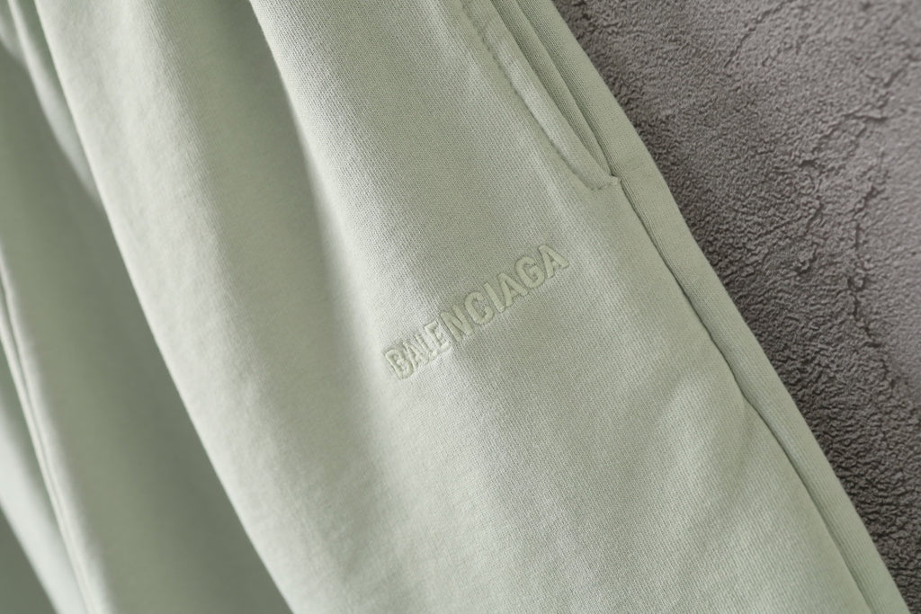Light-green shorts with Balenciaga logo print on the leg