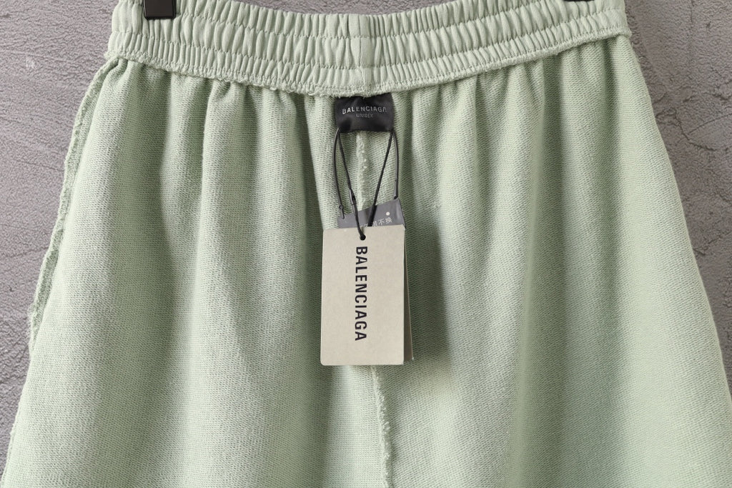 Light-green Balenciaga shorts with elastic waistband and hanging size label