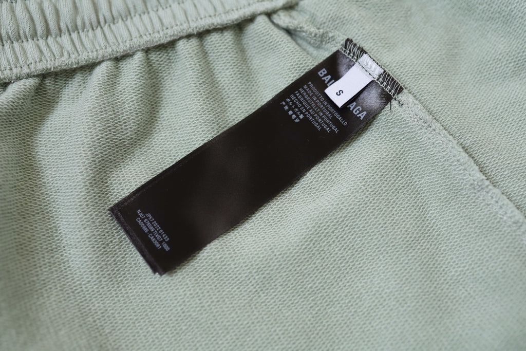 Balenciaga light green shorts with black size and care label at waistband