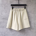 Balenciaga cream shorts with elastic waistband and small side logo